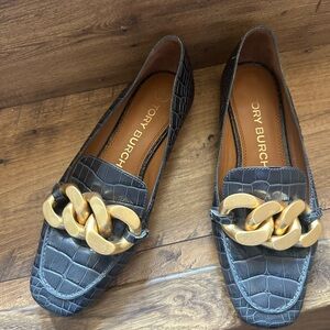 Tory Burch croc-embossed ruby loafers with gold chain.